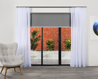 Single full width blind back rolled with s-fold sheer curtain on decorative black track