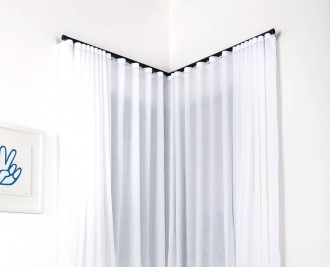 S-fold curtain on s-fold track, butt and through installation face fit <i>Note: curtains show puddling, not standard for builder clients</i>