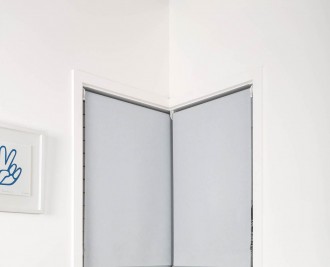 Single screen roller blind, front rolled, butt and through installed, reveal fit