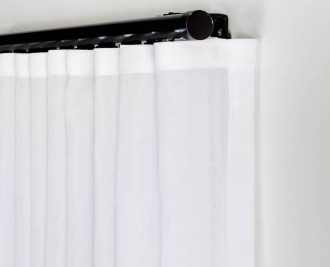 S-fold sheer curtain on decorative black track